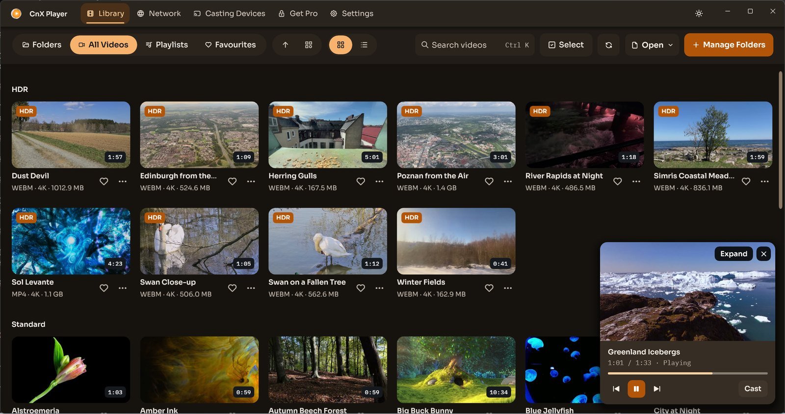 CnX's library with a mini player card in the bottom right corner.