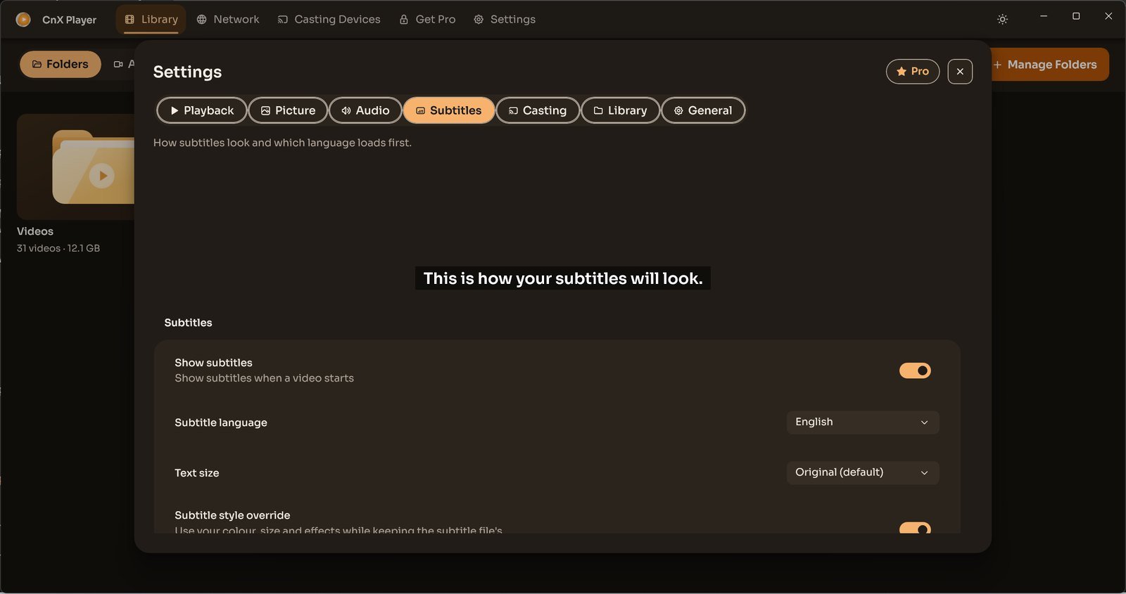 CnX Player's Settings window on the Subtitles tab with a subtitle preview.